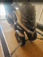 Trike Motorcycle securely transported in enclosed trailer by ADL Logistics for premium vehicle transport services from NY to CA